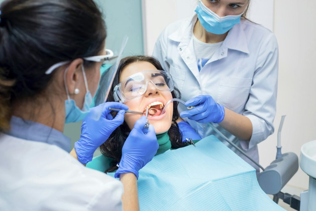 Two dental doctors and patient