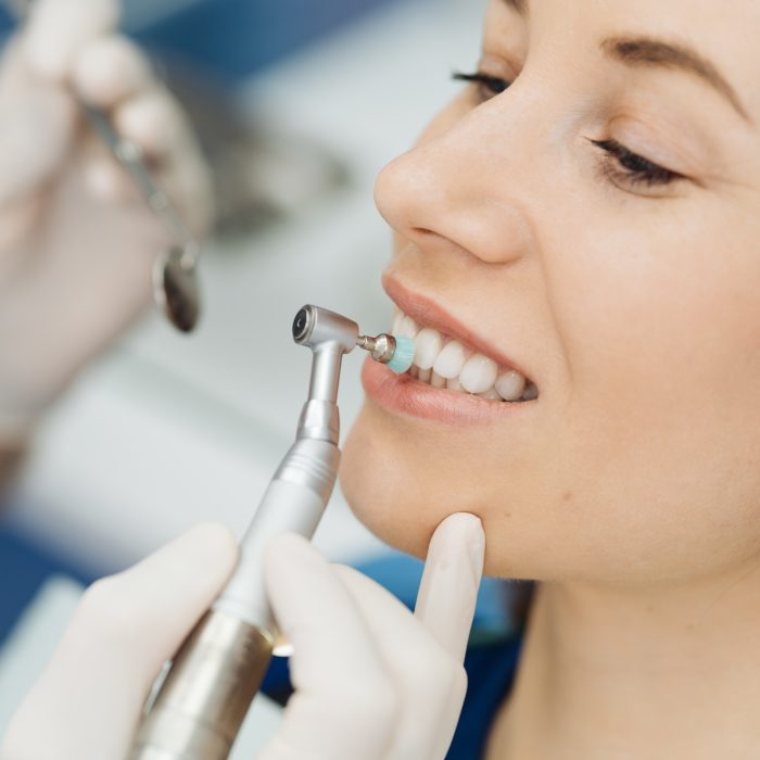 Oral hygiene, dentist doing Scaling and brushing procedure